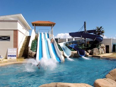 Outdoor pool area with water slides